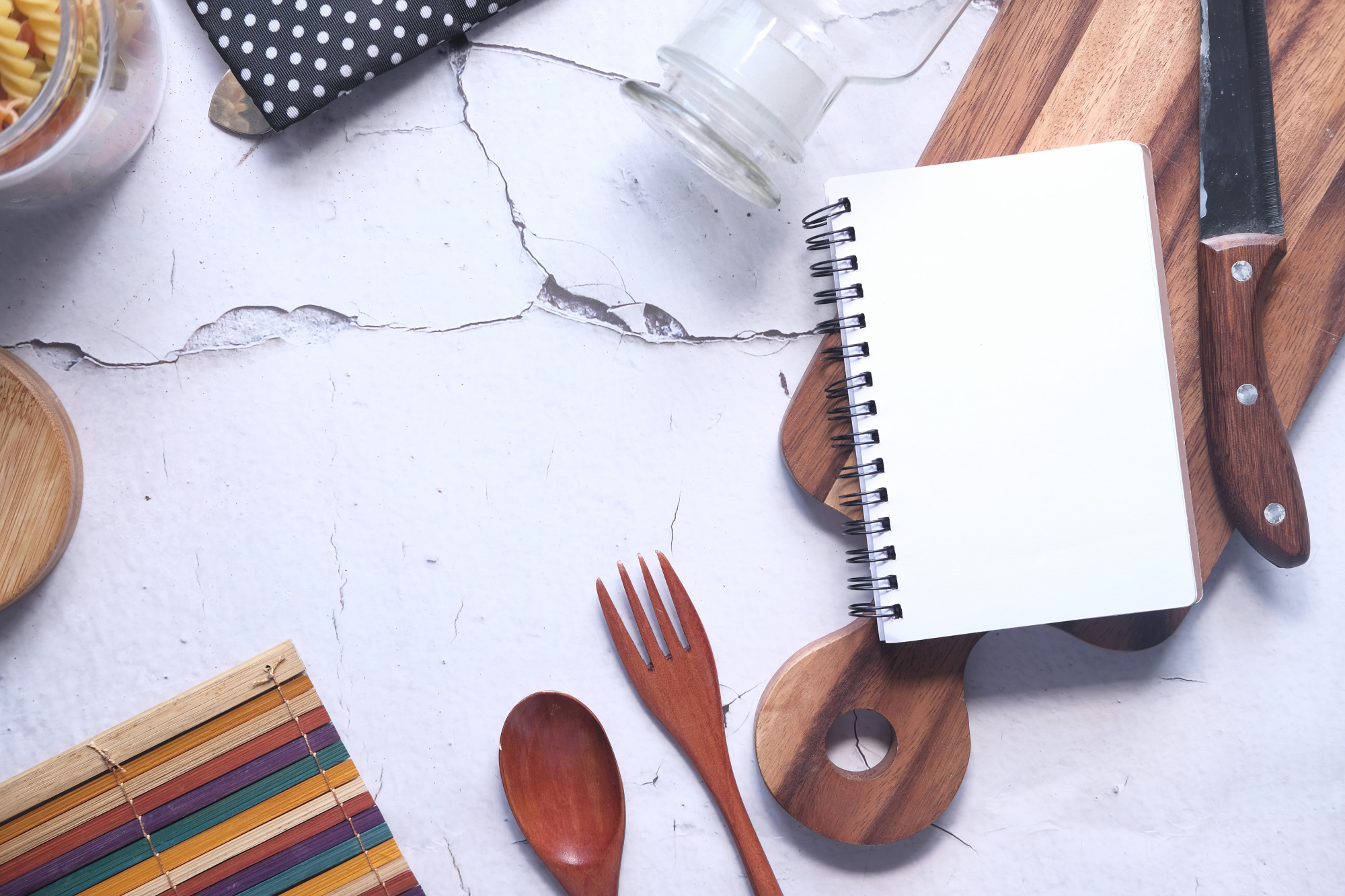 Studio kitchen workspace with utensils and notebook