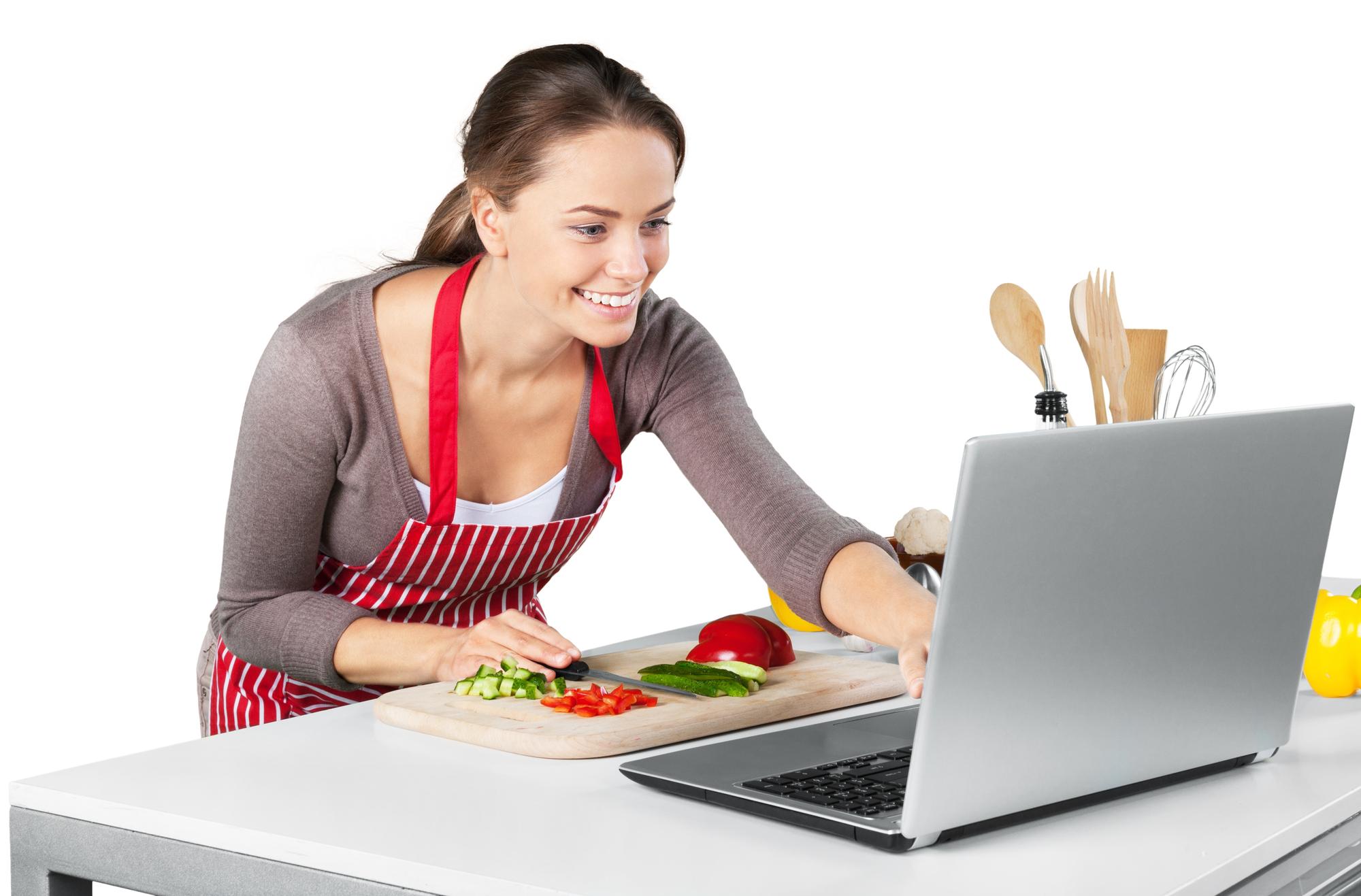 Student watching instructor on laptop with cooking tools